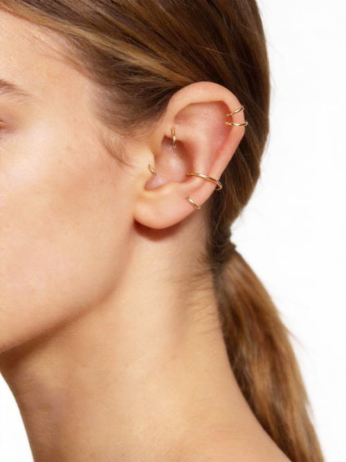 Shop our handmade 14K solid gold rook hoop. Nickel free, hypoallergenic, and lightweight for a refined, delicate look. Available in 18G and 20G with diameters from 6mm to 8mm, including half sizes. — 14K solid gold by Stepoy
