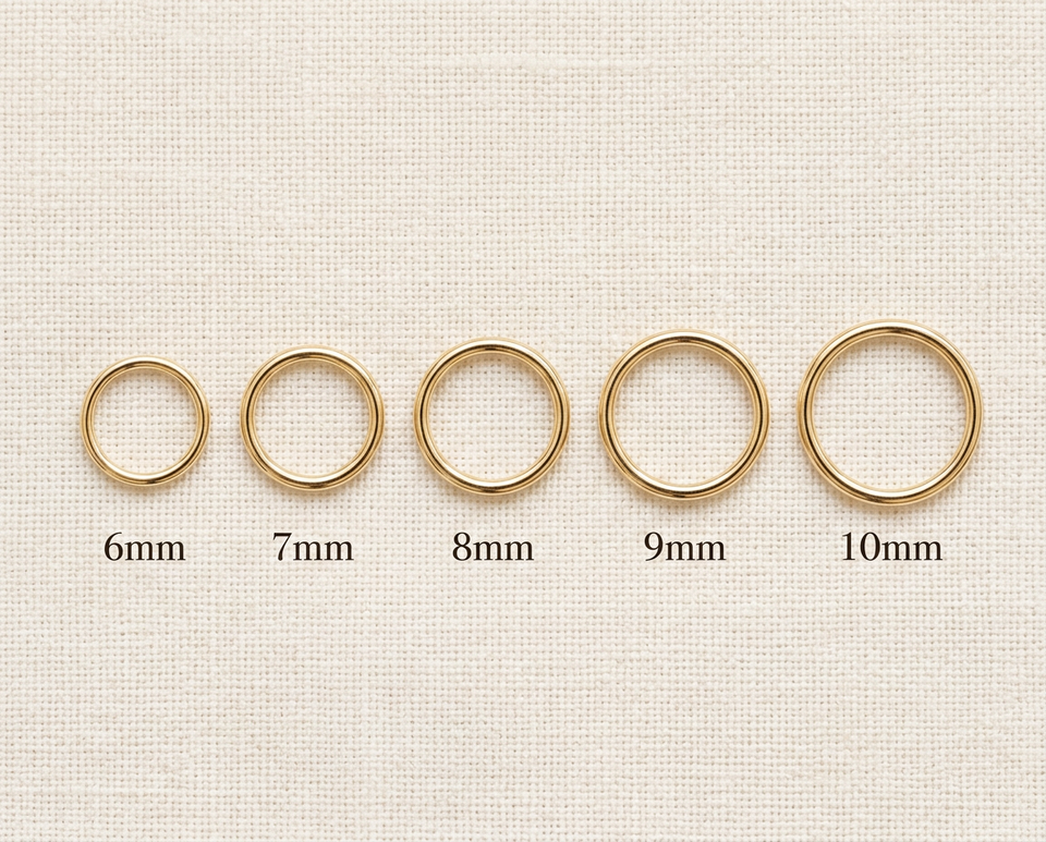 14K gold seamless nose ring size comparison showing 6mm, 7mm, 8mm, 9mm and 10mm diameter hoops on nostril