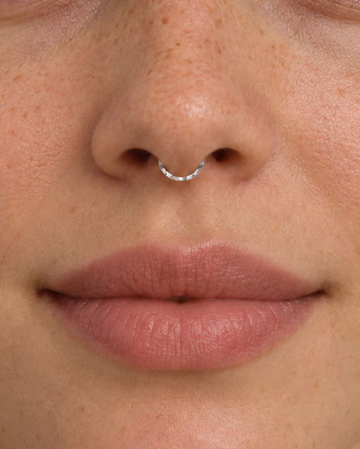 A delicate 14ct solid gold seamless septum hoop with a hand-hammered lower half. Choose 16G or 18G in yellow, white or rose gold. Handmade to order.