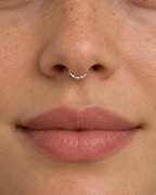 A delicate 14ct solid gold seamless septum hoop with a hand-hammered lower half. Choose 16G or 18G in yellow, white or rose gold. Handmade to order.
