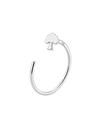 A polished silver open-ended ring featuring a small tree-shaped gold nose ring with a tree silhouette at its center, displayed on a clean white background.