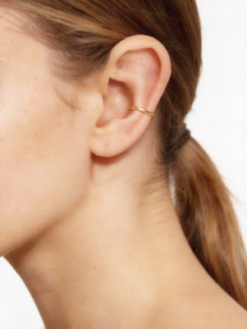 Handcrafted in genuine 14K solid gold, this daith hoop is designed with a refined, seamless look. Nickel free, hypoallergenic, and lightweight for elegant everyday wear. Available in 18G and 20G with inner diameters from 8mm to 10mm, including half sizes.