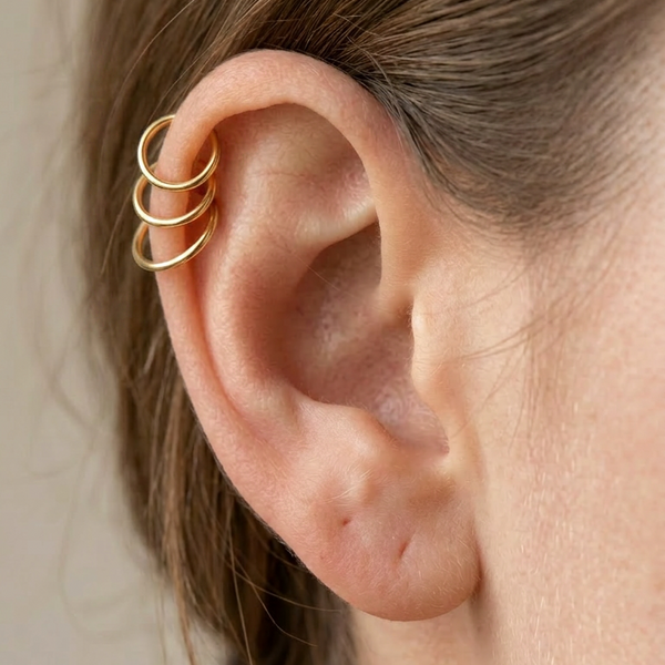 14ct gold half-size hoop on a healed forward helix piercing