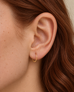 Small 14ct solid gold lobe hoop earring with unique hand-hammered texture. Choose 8–12mm, 18G or 20G, in yellow, white or rose gold. Sold individually.