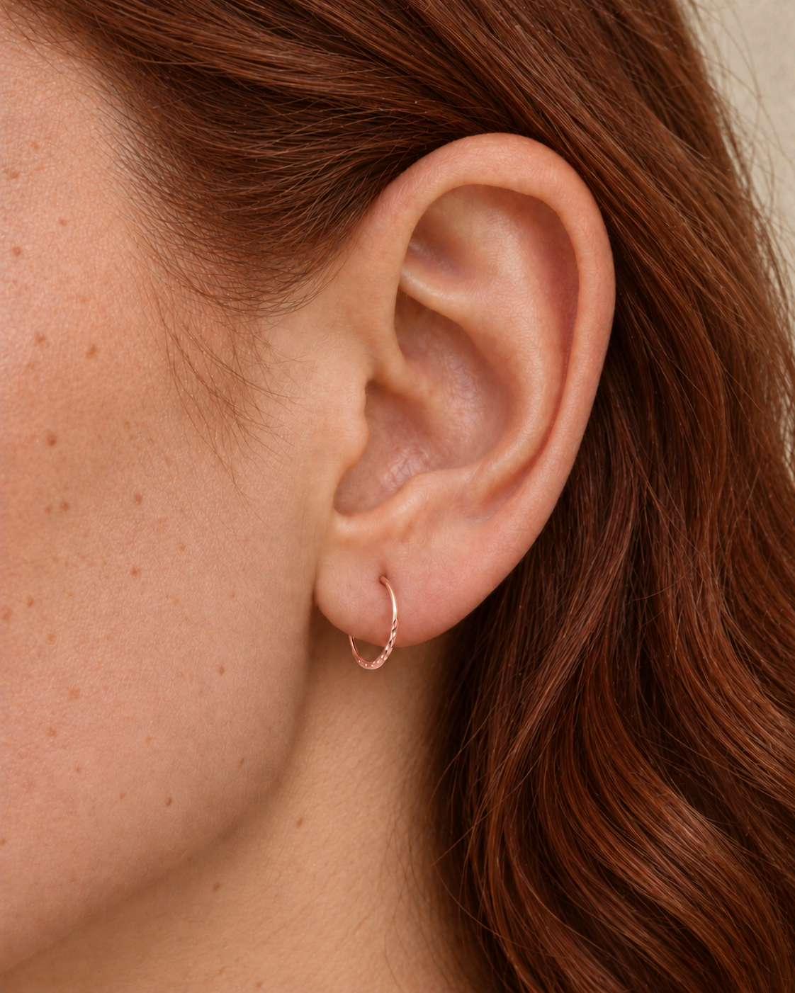 Small 14ct solid gold lobe hoop earring with unique hand-hammered texture. Choose 8–12mm, 18G or 20G, in yellow, white or rose gold. Sold individually.