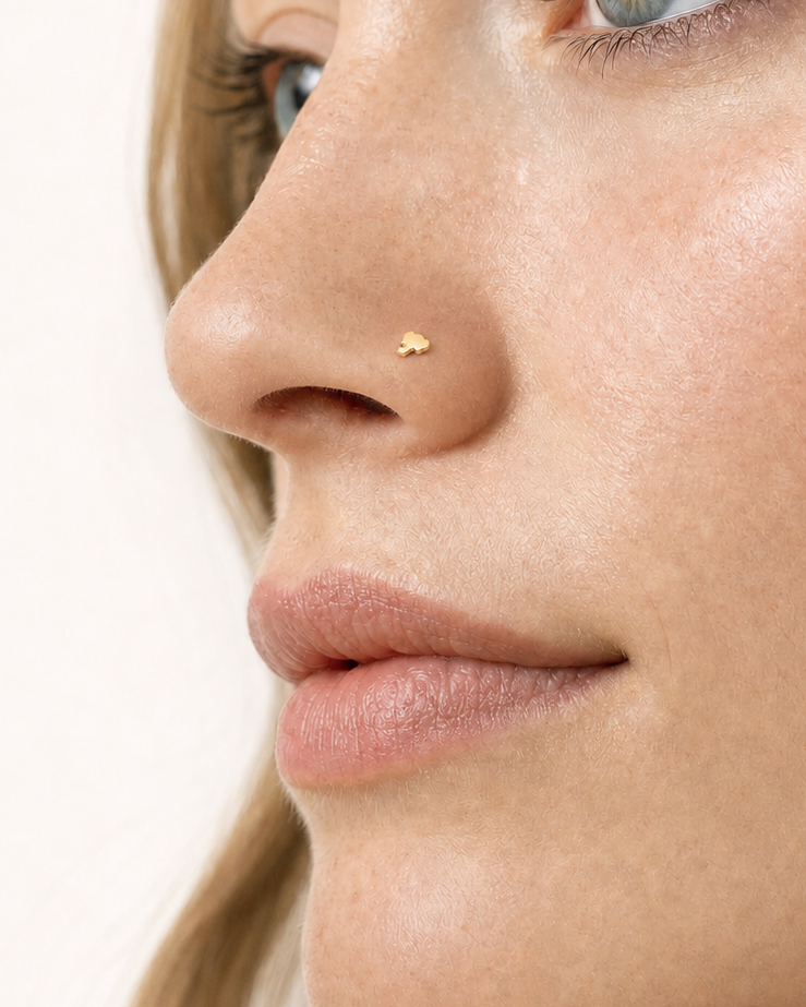 A playful 14ct solid gold Elephant Hoop with a tiny elephant head, rounded ears and curved trunk. Available in 18G or 20G and 6–10mm.