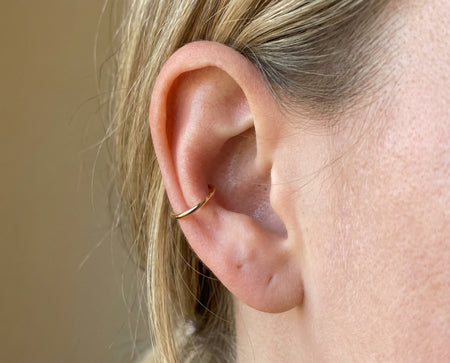 Conch Piercing piercing with 14K solid gold hoop ring