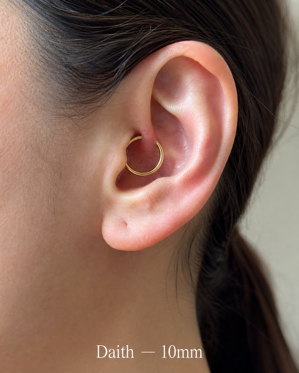 10mm 14K gold daith hoop in ear