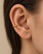 Discover Glimmer, a 14ct solid gold conch ring with a unique hand-hammered texture. Handmade to order in 10–15mm diameters, with a choice of 18G or 16G.