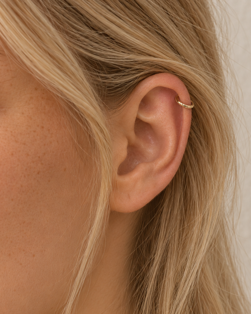 Style your ear stack with Ember, a 14ct solid gold seamless helix hoop with a hand-hammered outer curve. Choose 6–10mm, 18G or 20G, in three gold colours.