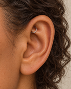 Handmade 14ct solid gold rook hoop with unique hammer marks. Choose 4–8mm, 16G, 18G or 20G, in yellow, white or rose gold for your fully healed rook piercing.