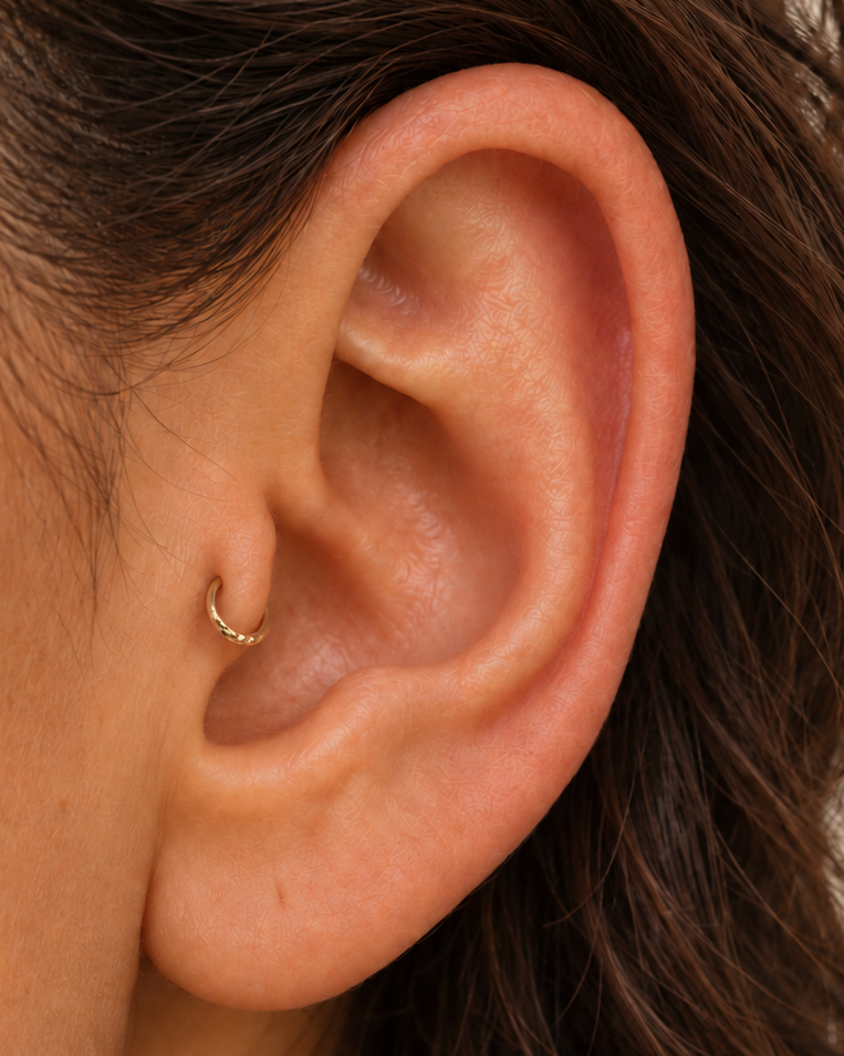 Handmade 14ct solid gold tragus hoop with unique hammer marks. Choose 4–8mm, 18G or 20G, in yellow, white or rose gold for your healed cartilage piercing.
