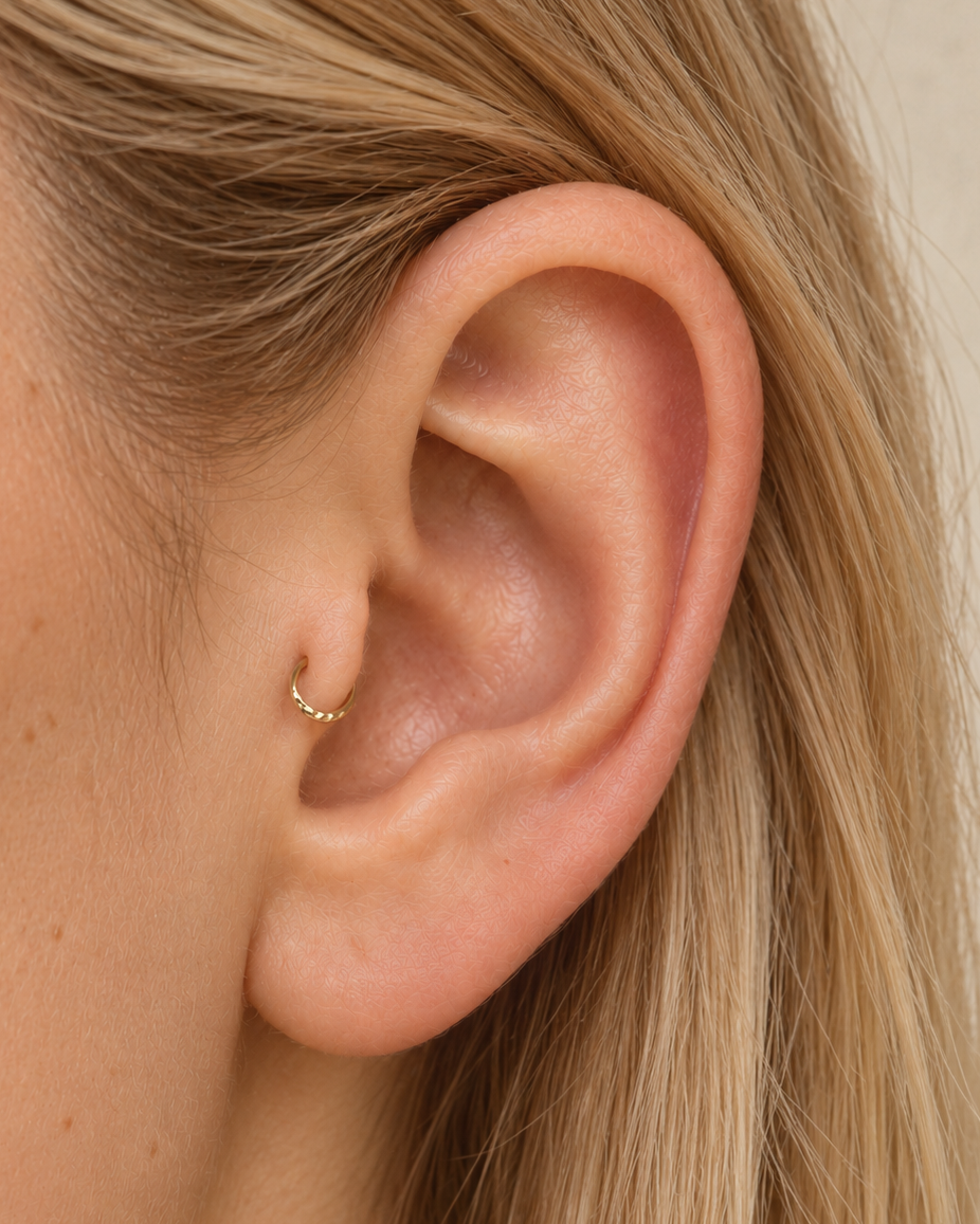 Handmade 14ct solid gold tragus hoop with unique hammer marks. Choose 4–8mm, 18G or 20G, in yellow, white or rose gold for your healed cartilage piercing.