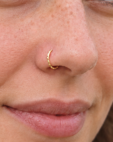 A little light, entirely your own. Discover Glimmer, a 14ct solid gold nostril ring with a unique hand-hammered texture, handmade to order in your chosen fit.