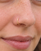 A little light, entirely your own. Discover Glimmer, a 14ct solid gold nostril ring with a unique hand-hammered texture, handmade to order in your chosen fit.