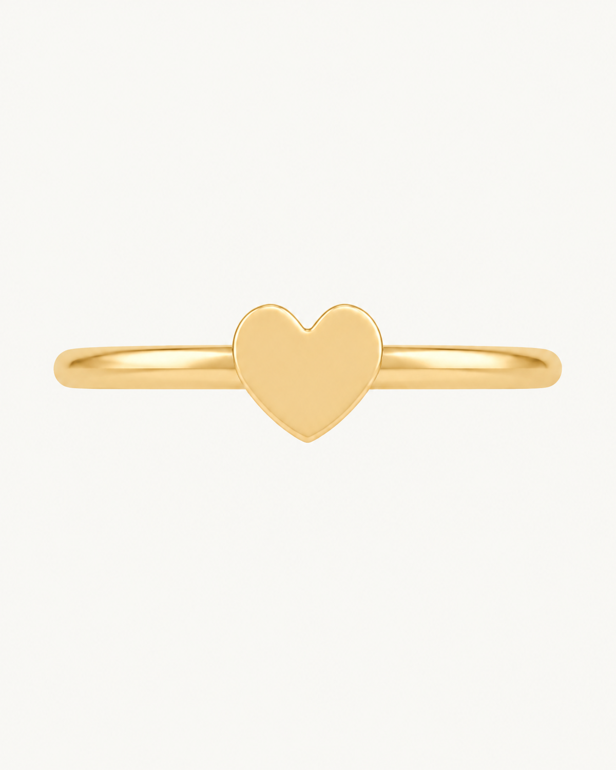 A softly rounded heart adds a sweet, personal detail to a simple gold hoop. Made for fully healed helix piercings, it keeps the profile compact for an upper-ear stack while leaving the motif clearly visible. Handmade to order in 14ct solid gold, it fits naturally with soft, personal and romantic styling rather than reading as a generic plain hoop.