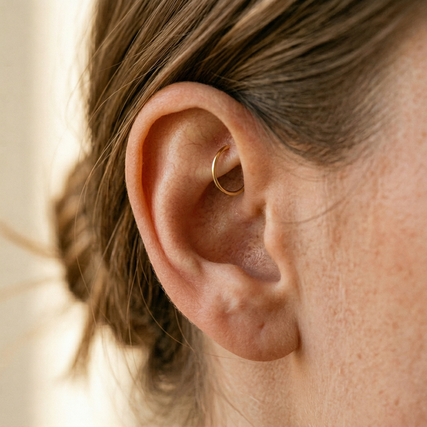 Customer wearing STEPOY 14ct gold seamless hoop