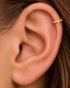 A polished oval adds a softer geometric detail for a clean, understated look. Made for fully healed helix piercings, it keeps the profile compact for an upper-ear stack while leaving the motif clearly visible. Handmade to order in 14ct solid gold, it fits naturally with softly geometric and minimal styling rather than reading as a generic plain hoop.