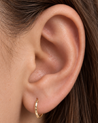 Small 14ct solid gold lobe hoop earring with unique hand-hammered texture. Choose 8–12mm, 18G or 20G, in yellow, white or rose gold. Sold individually.