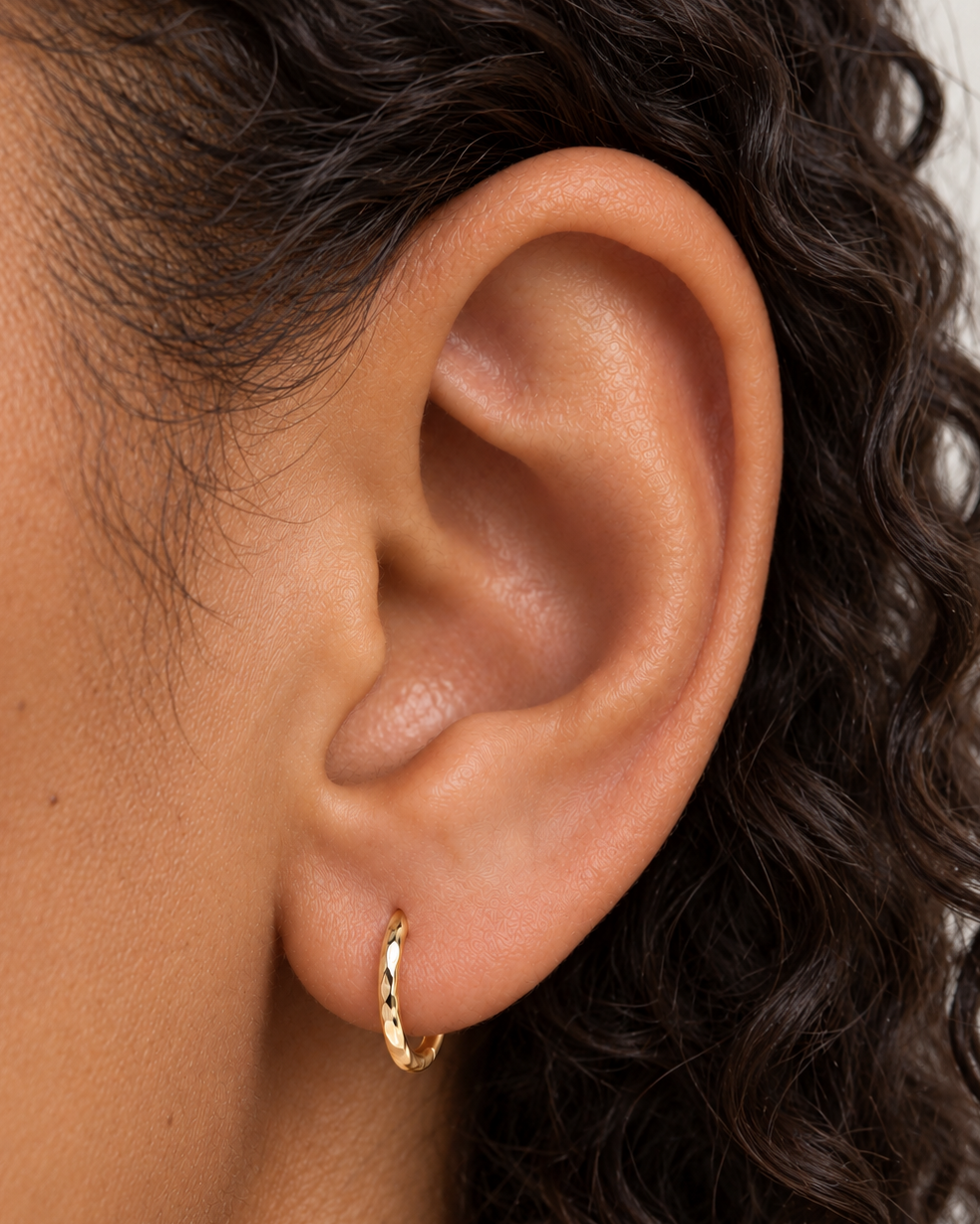 Small 14ct solid gold lobe hoop earring with unique hand-hammered texture. Choose 8–12mm, 18G or 20G, in yellow, white or rose gold. Sold individually.