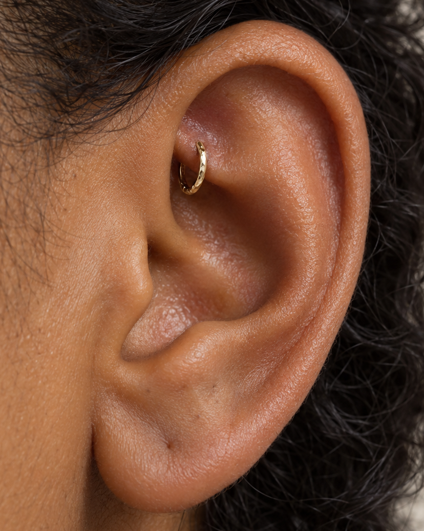 Handmade 14ct solid gold rook hoop with unique hammer marks. Choose 4–8mm, 16G, 18G or 20G, in yellow, white or rose gold for your fully healed rook piercing.
