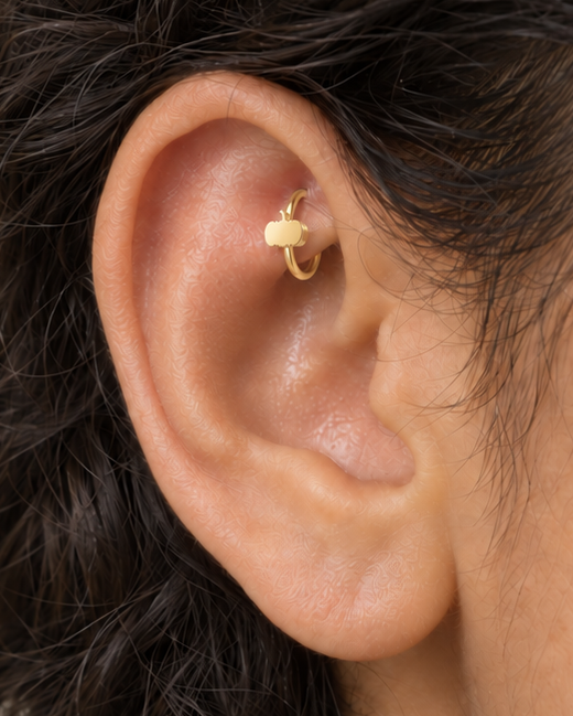 A tiny pumpkin adds an autumn and Halloween note while keeping the piece polished and wearable. Made for fully healed traditional rook piercings, it gives a small curved ear placement a clear motif-led detail while keeping the hoop clean and wearable. Handmade to order in 14ct solid gold, it fits naturally with autumnal, festive and Halloween-led styling rather than reading as a generic plain hoop.