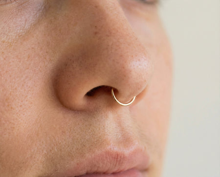 Septum Piercing piercing with 14K solid gold hoop ring