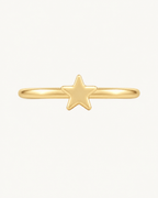 A crisp little star adds a bright celestial point to an otherwise minimal gold hoop. Made for fully healed helix piercings, it keeps the profile compact for an upper-ear stack while leaving the motif clearly visible. Handmade to order in 14ct solid gold, it fits naturally with bright, celestial and playful styling rather than reading as a generic plain hoop.