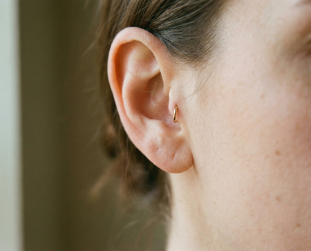 Tragus Piercing piercing with 14K solid gold hoop ring