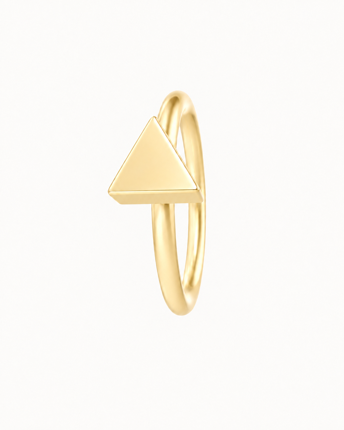 A small triangle gives the hoop a sharper geometric detail with a clean modern feel. Made for fully healed lobe piercings and sold individually, it works easily in first, second or third-lobe stacks. Handmade to order in 14ct solid gold, it fits naturally with clean, geometric and modern styling rather than reading as a generic plain hoop.