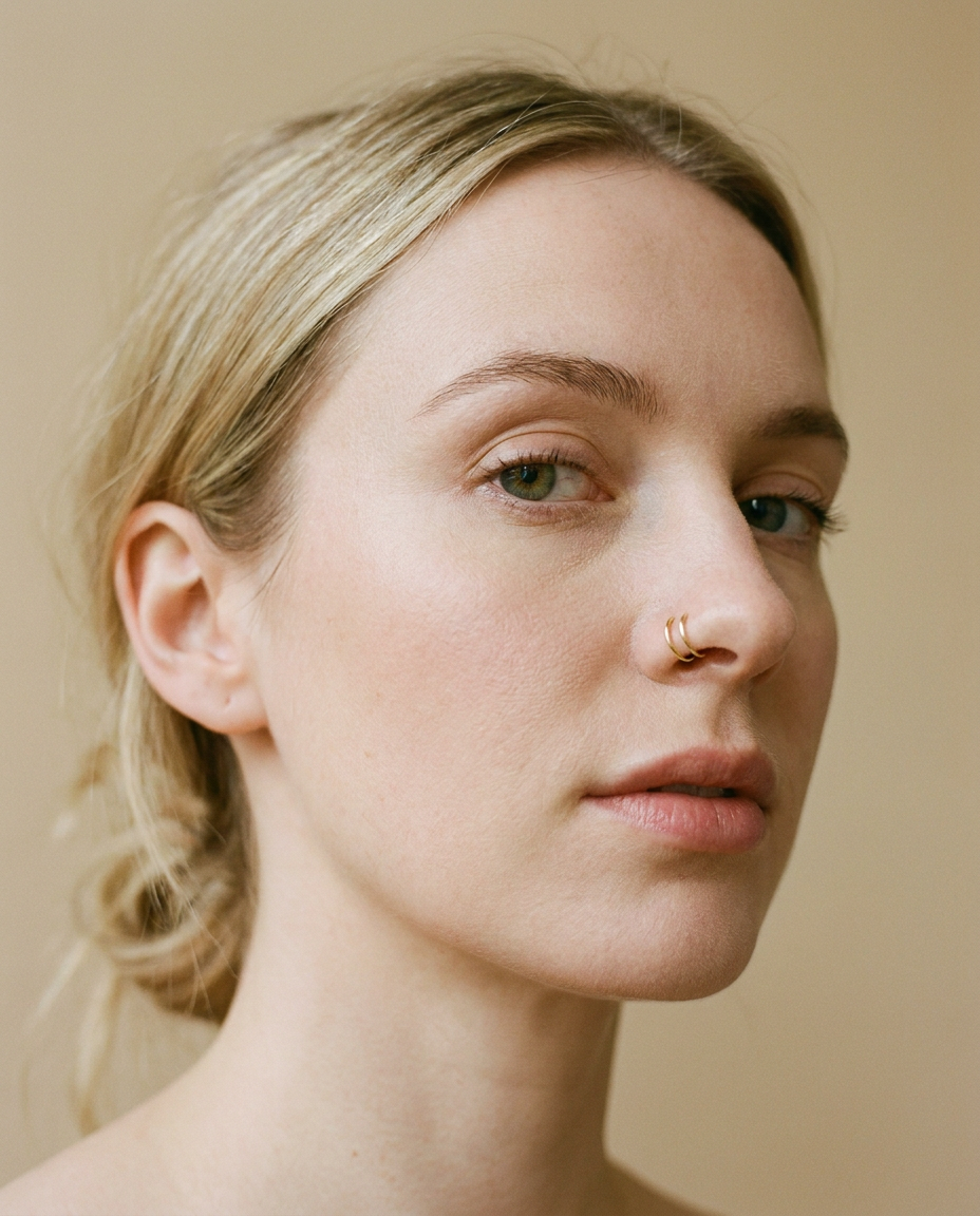 14ct gold double nose ring worn in one healed nostril piercing