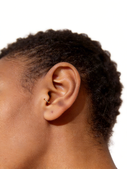 Handcrafted in genuine 14K solid gold, this tragus hoop is lightweight, nickel free, and hypoallergenic — designed for a delicate, low-profile look and everyday comfort. Available in 18G and 20G with inner diameters from 6mm to 8mm, including half sizes.