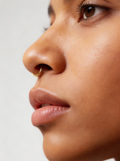 Handcrafted in genuine 14K solid gold, this septum hoop is designed with a refined, minimal feel. Nickel free, hypoallergenic, and lightweight for everyday comfort, it is available in 18G and 20G with inner diameters from 8mm to 12mm, including half sizes. — 14K solid gold by Stepoy