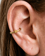 Choose a two-digit number from 10–99 for a more distinctive personalised detail. Made for fully healed conch piercings, it pairs the larger hoop silhouette of a conch ring with a small fixed motif for a more distinctive ear stack. Handmade to order in 14ct solid gold, it fits naturally with personalised, number-led and meaningful styling rather than reading as a generic plain hoop.
