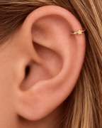 A tiny flower brings a light botanical accent without making the jewellery feel busy. Made for fully healed helix piercings, it keeps the profile compact for an upper-ear stack while leaving the motif clearly visible. Handmade to order in 14ct solid gold, it fits naturally with floral, botanical and nature-inspired styling rather than reading as a generic plain hoop.