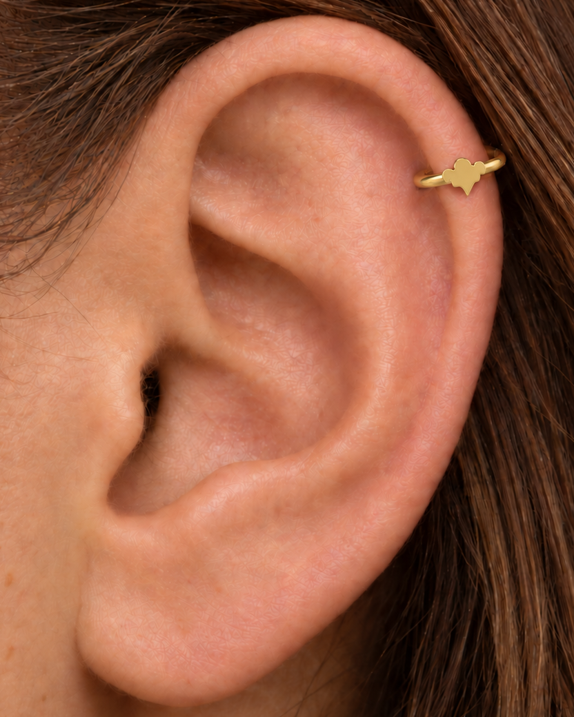 A small ghost motif adds a light spooky-season accent that still works as fine solid-gold jewellery. Made for fully healed helix piercings, it keeps the profile compact for an upper-ear stack while leaving the motif clearly visible. Handmade to order in 14ct solid gold, it fits naturally with spooky, playful and seasonal styling rather than reading as a generic plain hoop.