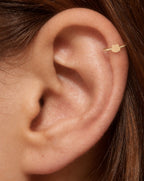This miniature frog head has two rounded bumps along the top and a broad, softly curved face. Its polished surface has no engraved eyes or mouth and no gemstones, keeping the frog silhouette clear and minimal.

Handmade to order in nickel-free 14ct solid gold, this frog helix hoop is available in yellow, white or rose gold. Choose a 5, 6 or 7mm internal diameter and 18G (1.0mm) or 20G (0.8mm). 