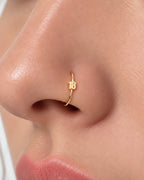 Choose a two-digit number from 10–99 for a more distinctive personalised detail. Made for fully healed nostril piercings, the motif sits directly on a clean round hoop so the look stays neat rather than dangly. Handmade to order in 14ct solid gold, it fits naturally with personalised, number-led and meaningful styling rather than reading as a generic plain hoop.