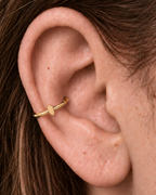 A polished oval adds a softer geometric detail for a clean, understated look. Made for fully healed conch piercings, it pairs the larger hoop silhouette of a conch ring with a small fixed motif for a more distinctive ear stack. Handmade to order in 14ct solid gold, it fits naturally with softly geometric and minimal styling rather than reading as a generic plain hoop.