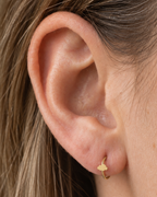 A softly rounded cloud adds a playful sky-inspired detail while keeping the scale small. Made for fully healed lobe piercings and sold individually, it works easily in first, second or third-lobe stacks. Handmade to order in 14ct solid gold, it fits naturally with soft, playful and sky-inspired styling rather than reading as a generic plain hoop.