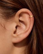 This miniature rabbit head has two long upright ears and a rounded face. Its smooth, polished surface has no engraved eyes, nose or whiskers and no gemstones, keeping the bunny silhouette simple and clear.

Handmade to order in nickel-free 14ct solid gold, this rabbit helix hoop is available in yellow, white or rose gold. Choose a 5, 6 or 7mm internal diameter and 18G (1.0mm) or 20G (0.8mm). 
