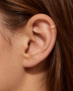 This miniature frog head has two rounded bumps along the top and a broad, softly curved face. Its polished surface has no engraved eyes or mouth and no gemstones, keeping the frog silhouette clear and minimal.

Handmade to order in nickel-free 14ct solid gold, this frog helix hoop is available in yellow, white or rose gold. Choose a 5, 6 or 7mm internal diameter and 18G (1.0mm) or 20G (0.8mm). 