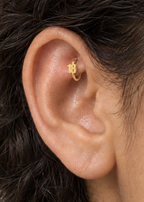 Choose a two-digit number from 10–99 for a more distinctive personalised detail. Made for fully healed traditional rook piercings, it gives a small curved ear placement a clear motif-led detail while keeping the hoop clean and wearable. Handmade to order in 14ct solid gold, it fits naturally with personalised, number-led and meaningful styling rather than reading as a generic plain hoop.