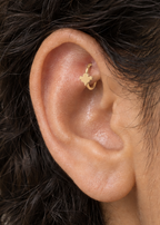 A small ghost motif adds a light spooky-season accent that still works as fine solid-gold jewellery. Made for fully healed traditional rook piercings, it gives a small curved ear placement a clear motif-led detail while keeping the hoop clean and wearable. Handmade to order in 14ct solid gold, it fits naturally with spooky, playful and seasonal styling rather than reading as a generic plain hoop.