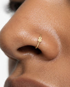 Two little ears, one playful detail. This 14ct solid gold rabbit nostril ring pairs an approximately 3mm polished bunny-head silhouette with a smooth seamless hoop. Upright ears with rounded tips and a softly curved face give the motif its character, with no engraved features or gemstones.
Handmade to order in yellow, white or rose gold, with inner diameters from 6 to 10mm and a choice of 18G (1.0mm) or 20G (0.8mm). Both the rabbit motif and hoop are solid gold and nickel-free, designed for a fully healed n