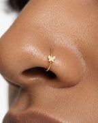 A delicate butterfly detail for your everyday jewellery. This 14ct solid gold butterfly nostril ring pairs an approximately 3mm polished butterfly silhouette with a smooth seamless hoop. Larger upper wings and smaller rounded lower wings create a soft, simple outline, with no gemstones or engraved decoration.
Handmade to order in yellow, white or rose gold, with inner diameters from 6 to 10mm and a choice of 18G (1.0mm) or 20G (0.8mm). Both the butterfly and hoop are solid gold and nickel-free, designed for