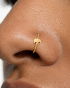A tiny elephant nose ring in 14ct solid gold. Handmade to order in yellow, white or rose gold, with 6–10mm diameters and 18G or 20G for healed nostril piercings.