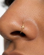 A small reminder of the seaside, made to wear every day. This 14ct solid gold starfish nostril ring pairs an approximately 3mm polished starfish with a smooth seamless hoop. Five gently curved arms and rounded tips give the motif a soft, natural outline.
Handmade to order in yellow, white or rose gold, with inner diameters from 6 to 10mm and a choice of 18G (1.0mm) or 20G (0.8mm). Both the starfish and hoop are solid gold and nickel-free, designed for a fully healed nostril piercing.
Wear it alone for a sub