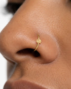 A little garden character for your everyday jewellery. This 14ct solid gold snail nostril ring pairs an approximately 3mm polished snail silhouette with a smooth seamless hoop. A rounded shell, low body and two curved feelers define the design, with no engraved spiral or gemstones.
Handmade to order in yellow, white or rose gold, with inner diameters from 6 to 10mm and a choice of 18G (1.0mm) or 20G (0.8mm). Both the snail and hoop are solid gold and nickel-free, designed for a fully healed nostril piercing